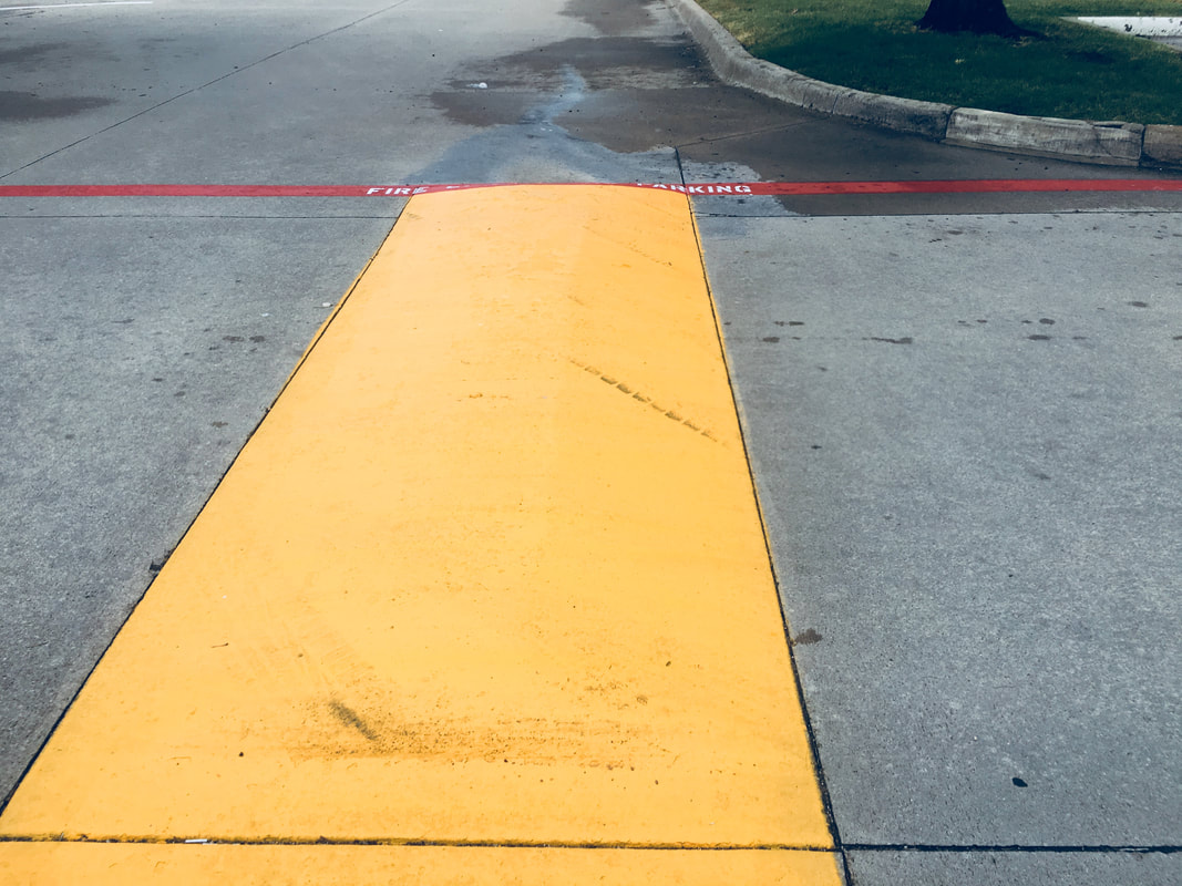 Parking-Lot-Speed-Bumps-Painted-Yellow