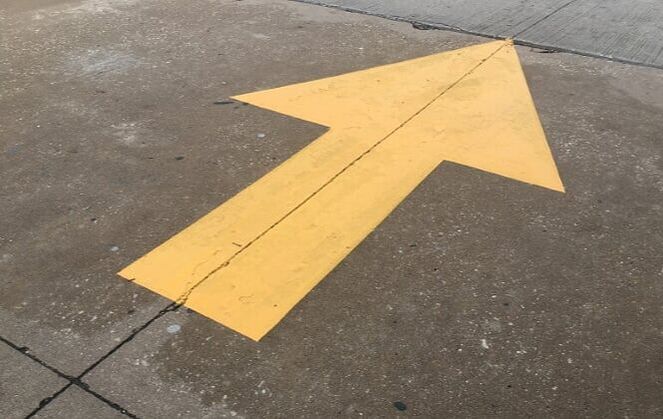 Yellow directional arrow in your parking lot in Isle of Palms, South Carolina